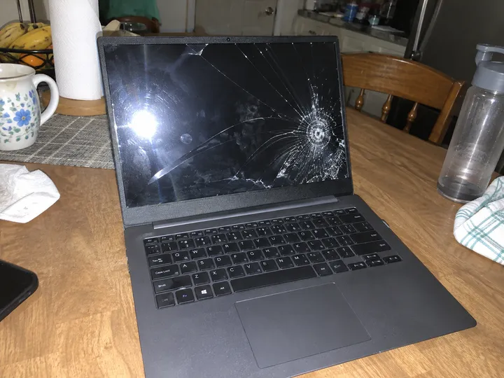 Example photo of a damaged parcel and item on a desk